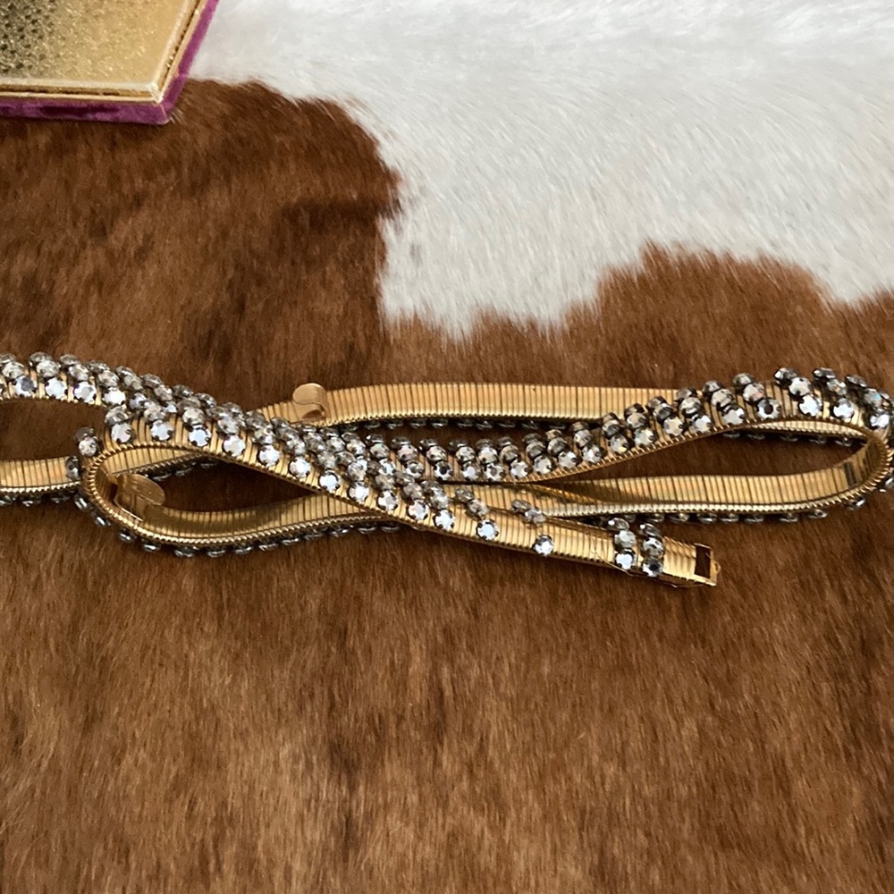 Women’s rhinestone  belt expands 24” to 36”.